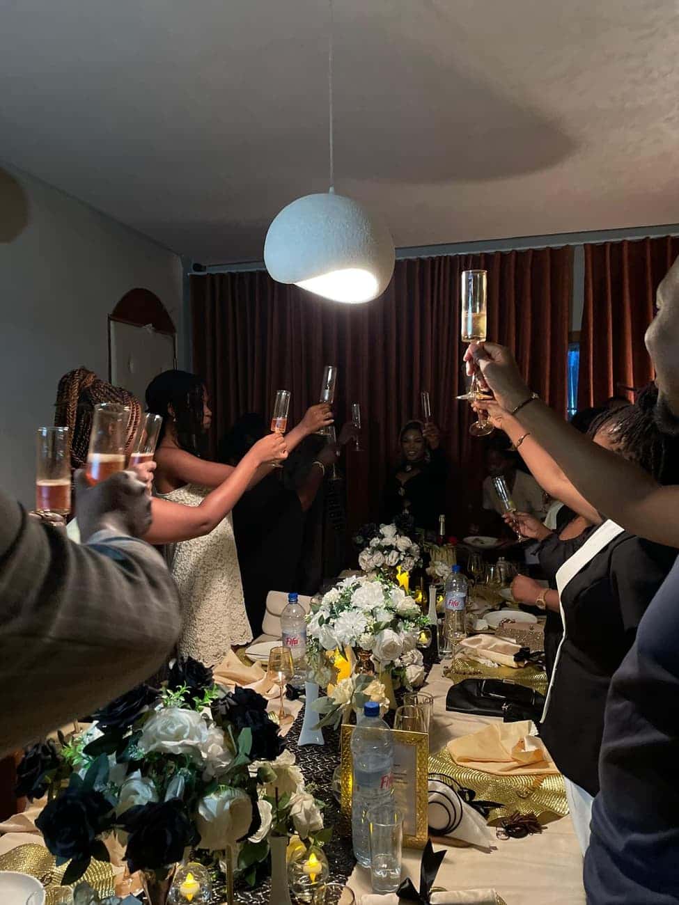 Guests toasting with champagne at table