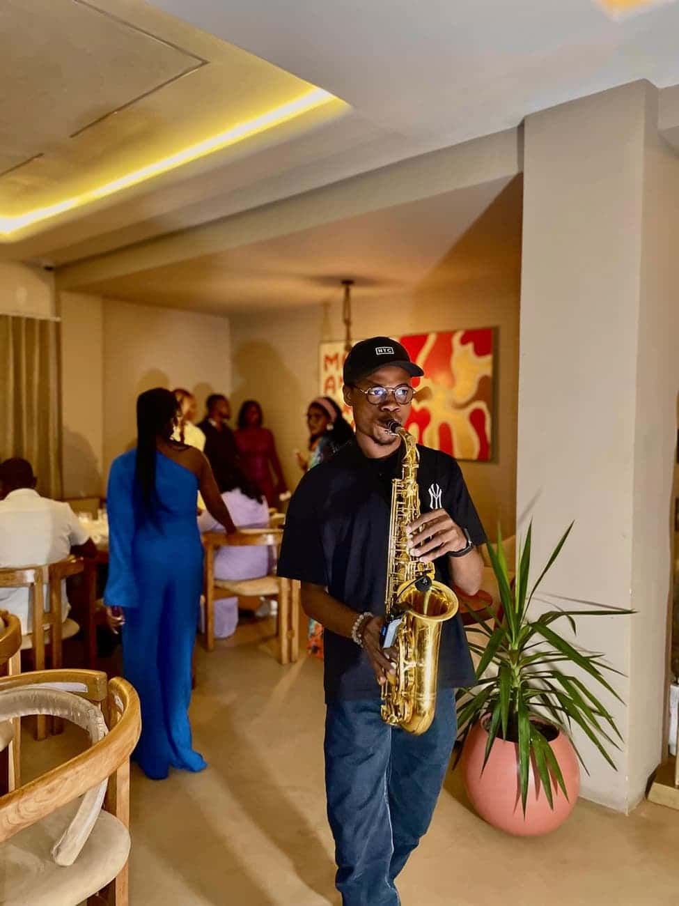 Saxophonist performing in the dining room