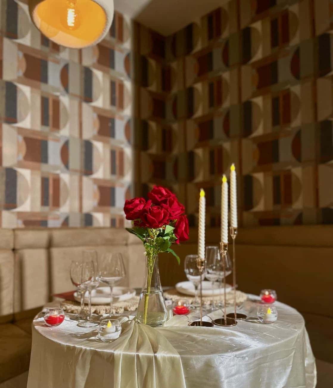 Romantic table with roses and candles