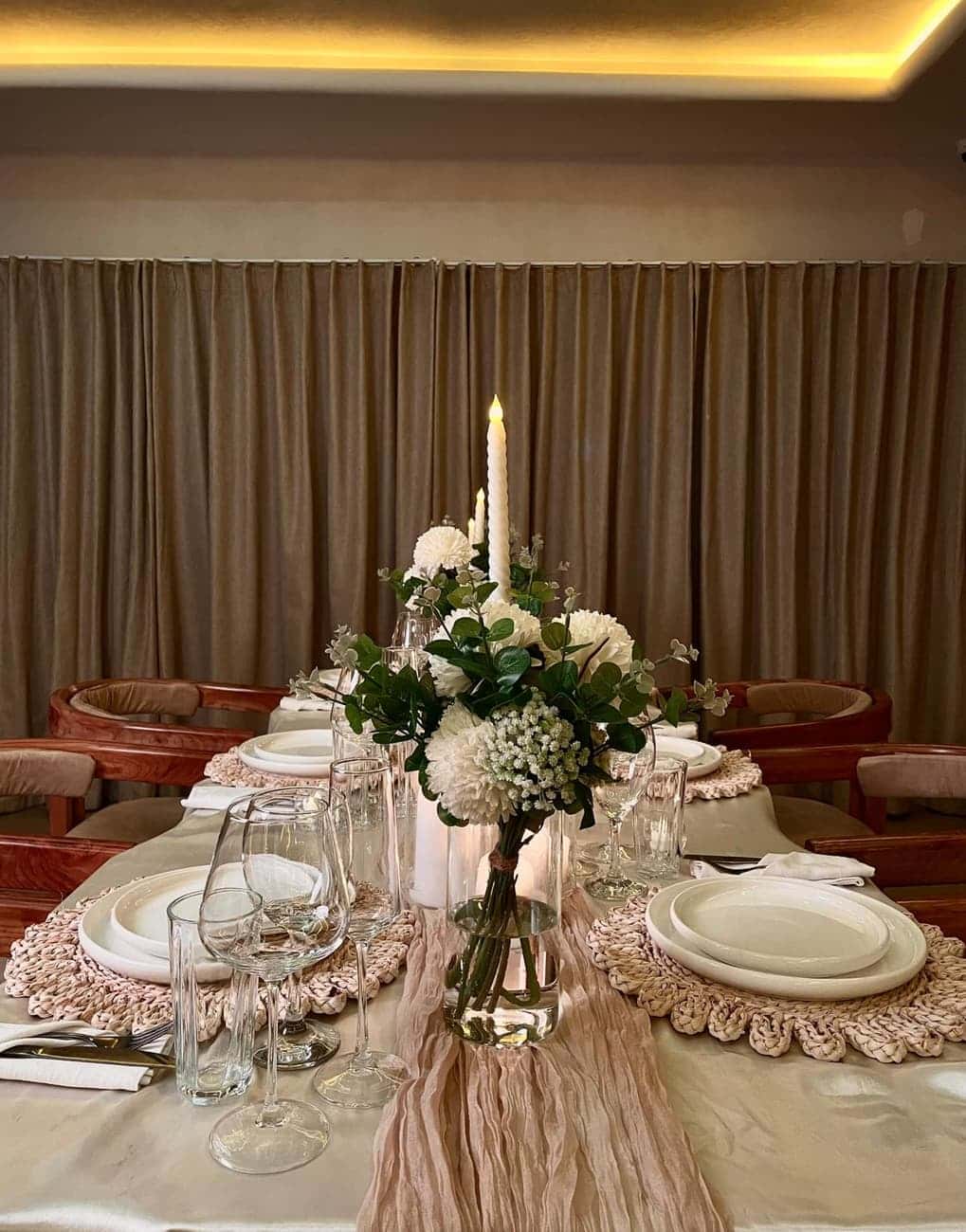 Elegant table setting with floral centerpiece