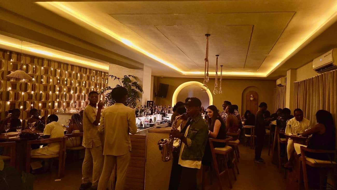 Saxophonist performing at busy bar