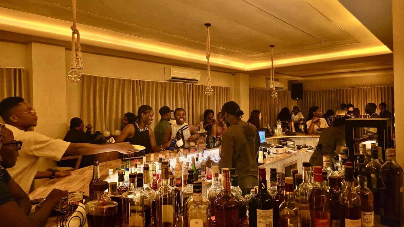 Stocked bar with lively guests