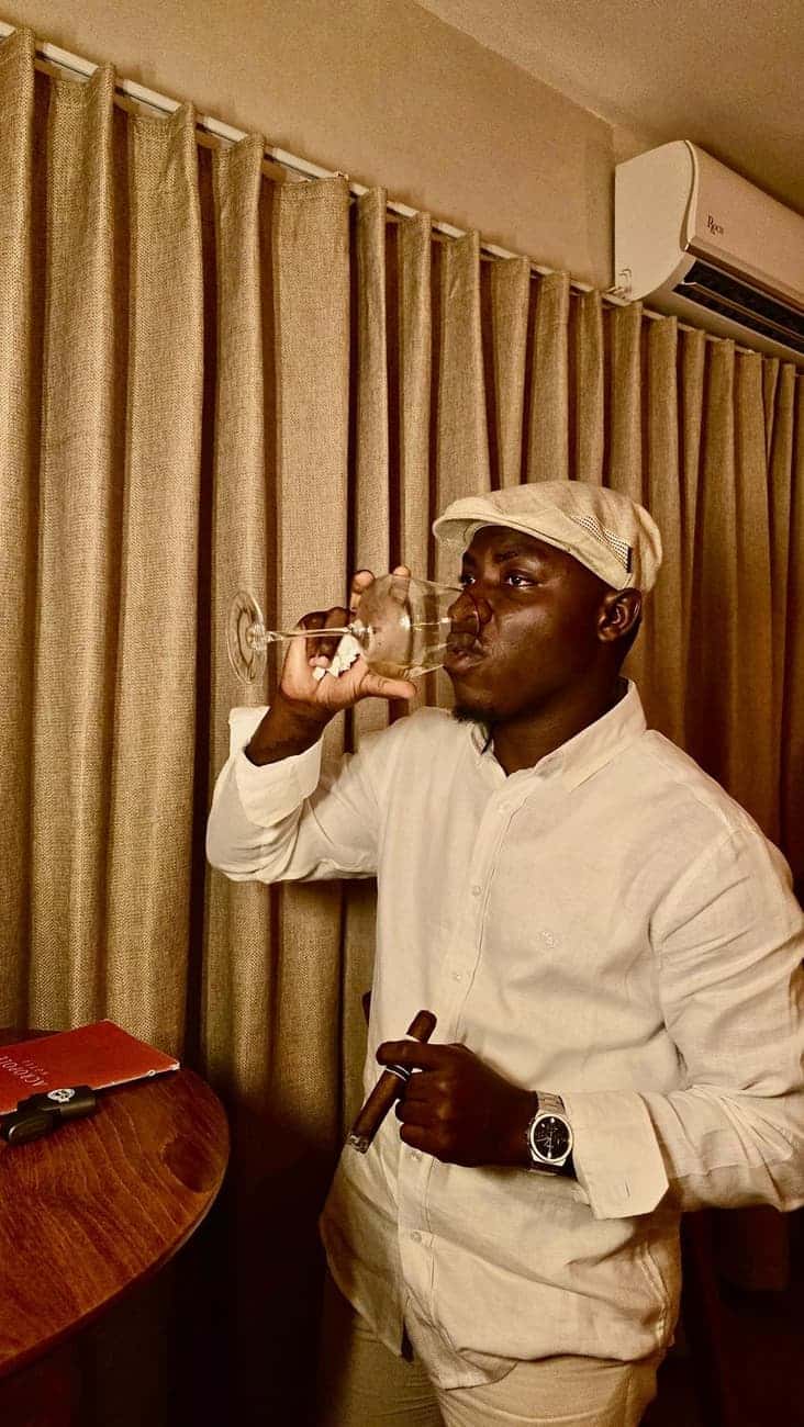 Man sipping a glass of wine