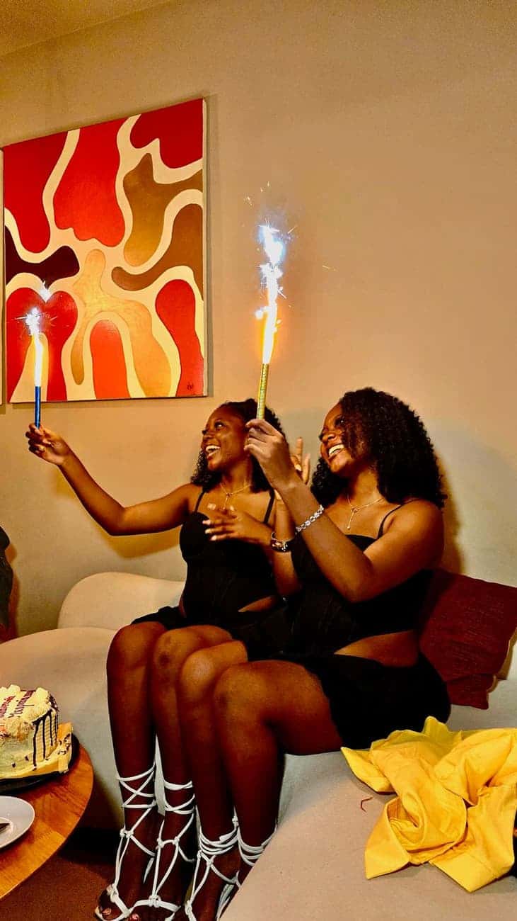 Friends laughing with sparkler candles