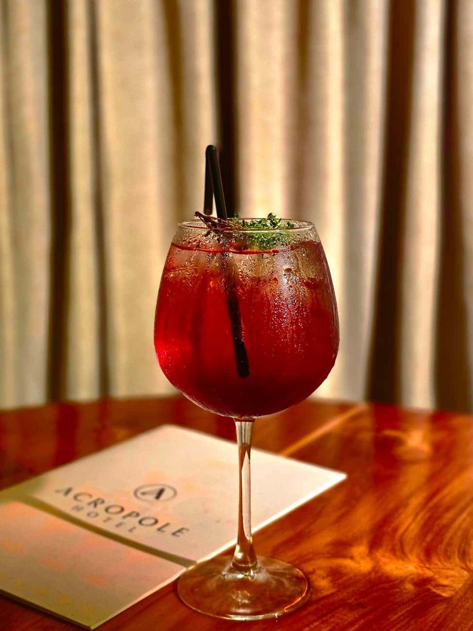 Red cocktail in a stemmed glass