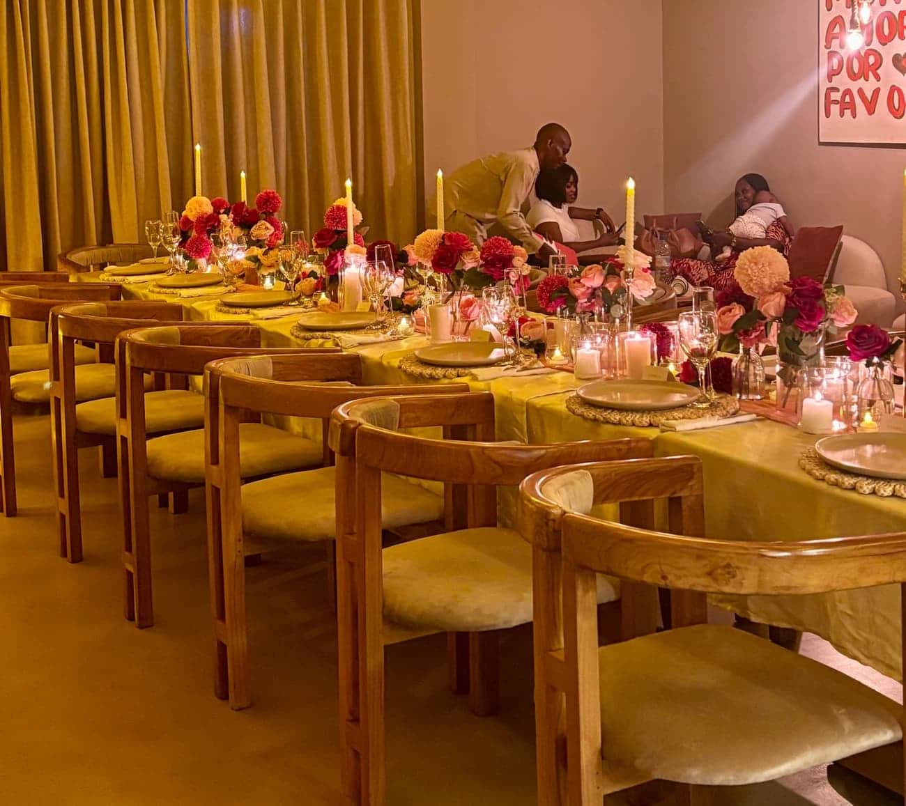 Guests at a long floral table