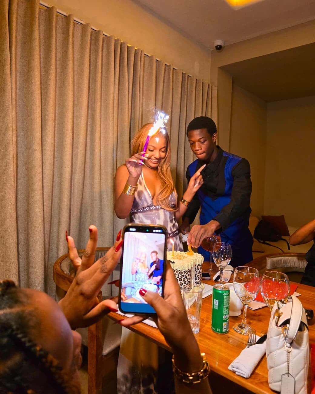Birthday celebration with sparkler and cake